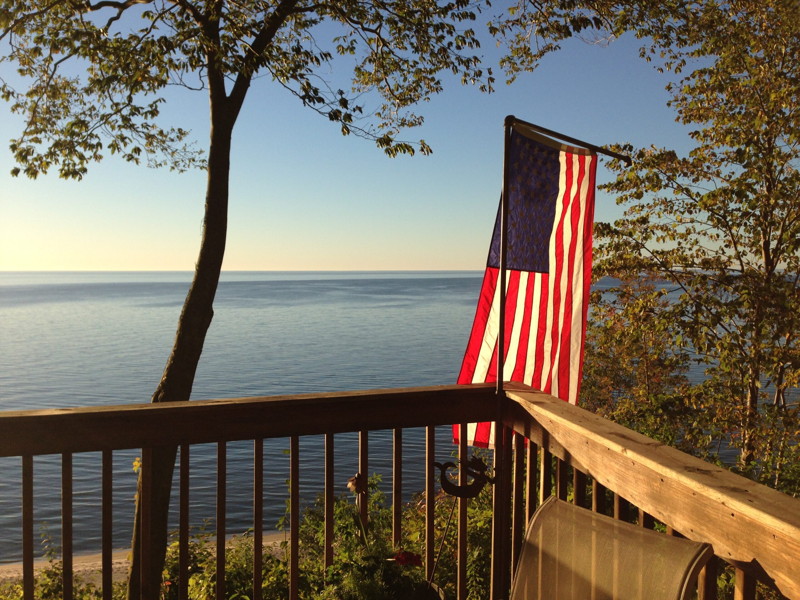 American flag over a Lake Michigan sunset