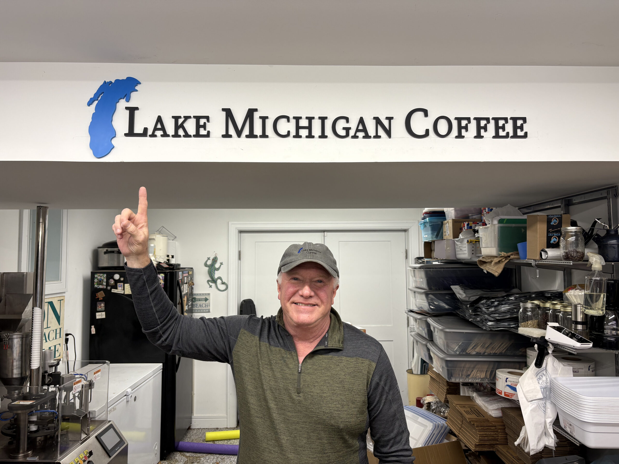 Jon standing under the Lake Michigan Coffee sign