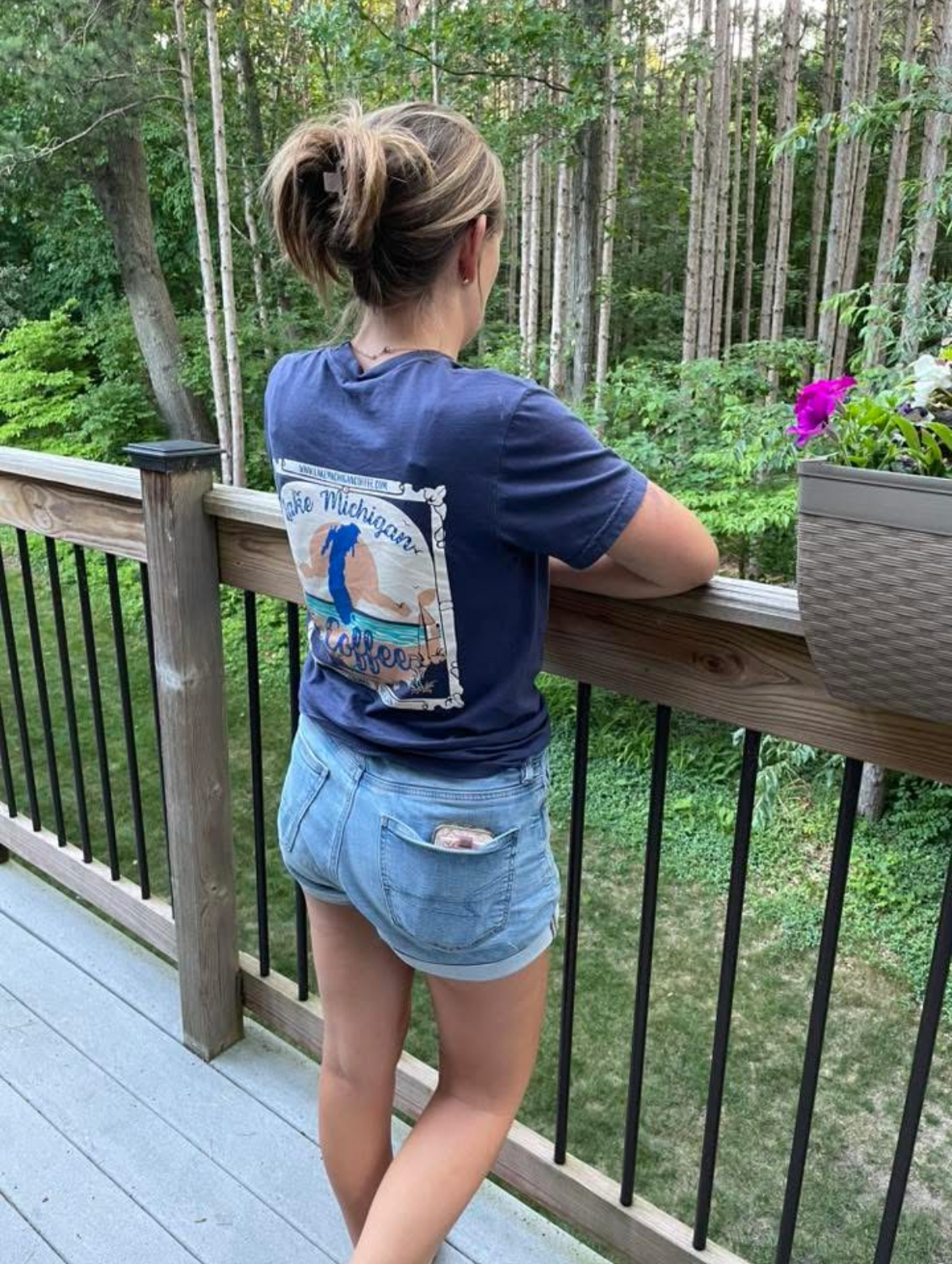 Home The back print of the navy Lake Michigan Coffee tee